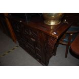 A CHINESE DARKWOOD SIDEBOARD, PROBABLY ELM, PROBABLY 19TH CENTURY, THE RECTANGULAR TOP WITH TWO