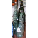 A COLLECTION OF ELEVEN LATE 19TH / EARLY 20TH CENTURY ASSORTED GLASS BOTTLES TO INCLUDE LEITCH OF