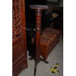 A 20TH CENTURY MAHOGANY TORCHIERE