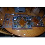 THREE SIMILAR STAINED LEADED AND COLOURED GLASS WINDOW PANEL OF ASSORTED SIZE.