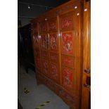 A CHINESE WEDDING CABINET, PROBABLY 19TH CENTURY, WITH TWO CUPBOARD DOORS OPENING TO A FITTED