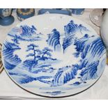 JAPANESE BLUE AND WHITE PORCELAIN CHARGER DECORATED WITH PAVILIONS IN A MOUNTAIN LANDSCAPE WITH PINE