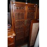 A CHINESE NARROW SIDE CABINET, 20TH CENTURY, WITH TWO LONG PIERCED AND PANEL CUPBOARD DOORS