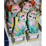 TWO PAIRS OF CHINESE PORCELAIN SHISHI DOGS, QING DYNASTY, PINK, GREEN AND YELLOW GLAZED DETAILS.