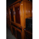 A CHINESE NINGBO STACKED CABINET, CONSTRUCTED IN DARK AND LIGHT WOOD, POSSIBLY ELM AND MULBERRY,