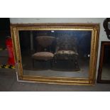 A GILT WOOD OVER MANTLE MIRROR, THE FRAME SET WITH SHELLS TO THE CORNERS