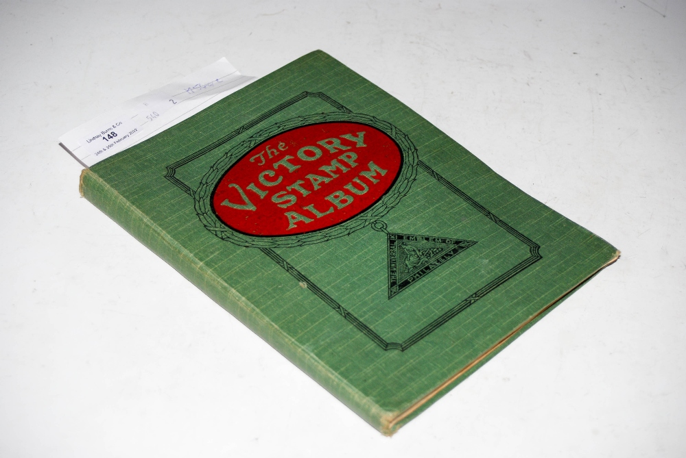 A VINTAGE VICTORY STAMP ALBUM CONTAINING STAMPS OF THE WORLD