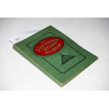 A VINTAGE VICTORY STAMP ALBUM CONTAINING STAMPS OF THE WORLD