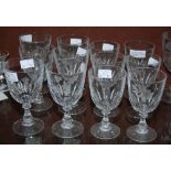 TWELVE CLEAR GLASS WINE GOBLETS, TWO SETS OF SIX, EACH WITH WHEEL-CUT DECORATION OF DIFFERENT