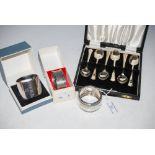 A CASED SET OF SIX BIRMINGHAM SILVER COFFEE SPOONS TOGETHER WITH THREE SILVER NAPKIN RINGS