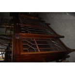 EARLY 20TH CENTURY MAHOGANY BREAKFRONT FOUR-DOOR ASTRAGAL GLAZED DISPLAY CABINET WITH DENTIL