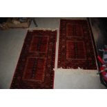 A PAIR OF MACHINE MADE PERSIAN STYLE MADDER GROUND RUGS