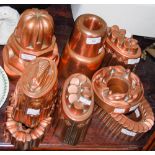 A GROUP OF TEN LATE 19TH / EARLY 20TH CENTURY COPPER JELLY MOULDS, INCLUDING SEVERAL EXAMPLES