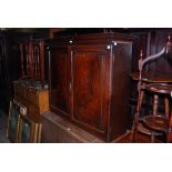 A 19TH CENTURY MAHOGANY TWO DOOR CUPBOARD