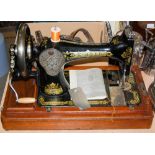 VINTAGE SINGER SEWING MACHINE IN WALNUT CASE.