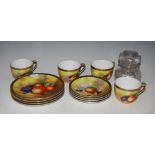 JAPANESE HAND-PAINTED PART TEA SET DECORATED WITH FRUIT ON A MOSSY GROUND, TOGETHER WITH A CUT GLASS