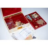 JEWELLERY BOX CONTAINING A LARGE COLLECTION OF ASSORTED COSTUME JEWELLERY.