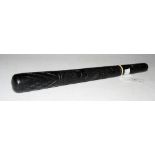 AN IRISH BOG OAK TRUNCHEON CARVED WITH THREE LEAF CLOVERS