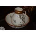 A 19TH CENTURY IVORY GROUND EWER AND BASIN IN THE AESTHETIC TASTE