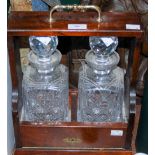 MAHOGANY AND GILT METAL MOUNTED TWO BOTTLE TANTALUS, 35.5CM HIGH.