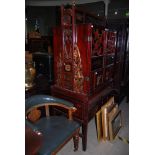 A CHINESE LACQUER AND GILT WEDDING CABINET, PROBABLY 19TH CENTURY, THE RAISED CENTRE SECTION