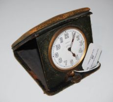 ASPREY, VINTAGE EIGHT DAY TRAVELLING BEDSIDE CLOCK WITH BLACK AND WHITE ARABIC NUMERAL DETAIL.
