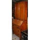 A 19TH CENTURY OAK AND PINE BUREAU BOOKCASE WITH TURNED EBONISED HANDLES