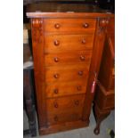 A 19TH CENTURY COMPACT MAHOGANY WELLINGTON CHEST OF SEVEN GRADUATED DRAWERS.