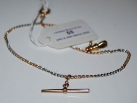 YELLOW AND WHITE METAL TWO COLOUR ALBERT CHAIN, THE T-BAR STAMPED '18CT', 12 GRAMS.