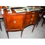 A REPRODUCTION MAHOGANY DINING ROOM SUITE EXTENDING TABLE, SIX CARVER CHAIRS AND A SIDEBOARD