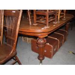 VICTORIAN OAK EXTENDING DINING TABLE, THE ROUNDED RECTANGULAR TOP ON FOUR TAPERED CYLINDRICAL