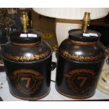 *A PAIR OF BLACK AND GILT TEA CANISTER TABLE LAMPS, INSCRIBED "7" ON SHIELD WITHIN LORAL BORDERS,