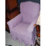 LATE 19TH/ EARLY 20TH CENTURY UPHOLSTERED ARMCHAIR WITH LOOSE PURPLE COVERS