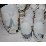 OPAQUE WHITE AND MILLEFIORE GLASS LEMONADE SET COMPRISING JUG AND SIX TUMBLERS.