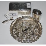 LONDON SILVER CIRCULAR TRAY WITH EMBOSSED FOLIATE SCROLL DETAIL, A LONDON SILVER CIGAR PUNCHER,