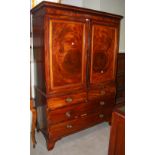 *A GEORGE III MAHOGANY AND BOXWOOD LINED LINEN PRESS, THE UPPER PART WITH TWO CUPBOARD DOORS ON A