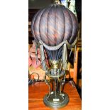 DECORATIVE GILT METAL AND MOTTLED GLASS TABLE LAMP AND SHADE IN THE FORM OF A HOT AIR BALLOON.