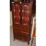 CHINESE DISPLAY CABINET WITH GLAZED CUPBOARD DOORS ON A BASE FITTED WITH LONG FRIEZE DRAWER, TWO