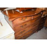 A 19TH CENTURY MAHOGANY CHEST, THE SERPENTINE TOP OVER TWO SHORT AND THREE LONG GRADUATED COCKBEADED