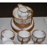 LATE 19TH/ EARLY 20TH CENTURY FLORAL DECORATED PART TEA SET WITH GILT EDGED DETAIL.