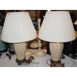 A PAIR OF CRACKLE GLAZED OCTAGONAL SHAPED TABLE LAMPS AND SHADES ON GILT METAL PLINTHS