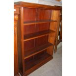 *AN EARLY 20TH CENTURY OPEN BOOKCASE WITH FOUR ADJUSTABLE SHELVES