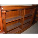 *A 19TH CENTURY OAK OPEN BOOKCASE WITH SIX ADJUSTABLE SHELVES, THE UPRIGHTS WITH FOLIATE SCROLL