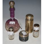 A COLLECTION OF FIVE ASSORTED SILVER MOUNTED DRESSING TABLE BOTTLES, TO INCLUDE A PURPLE FLASHED