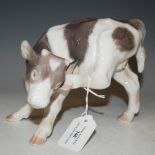 ROYAL COPENHAGEN PORCELAIN MODEL OF A CALF WITH COPENHAGEN BLUE THREE WAVE MARK TO THE BOTTOM,