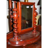 A VICTORIAN MAHOGANY SHAVING MIRROR ON SPIRAL CARVED UPRIGHTS WITH RECTANGULAR MIRROR PLATE
