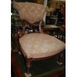 A 19TH CENTURY ROSEWOOD NURSING CHAIR WITH UPHOLSTERED BACK AND SEAT, TAPERED SUPPORTS WITH FLUTED