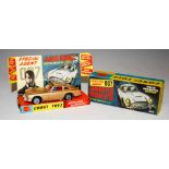 A CORGI TOYS MODEL 261 JAMES BOND ASTON MARTIN DB5 FROM THE FILM 'GOLDFINGER', GOLD BODY WITH RED