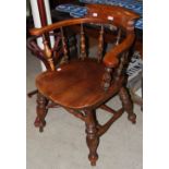 *LATE 19TH/ EARLY 20TH CENTURY MAHOGANY HORSESHOE BACK ARMCHAIR WITH SPINDLE-FILLED GALLERY AND