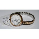 VINTAGE 9CT GOLD CASED WRISTWATCH WITH BLACK AND WHITE ARABIC NUMERAL DIAL BEARING SUBSIDIARY